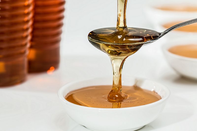 Le miel et les abeilles à la fête pour la Foire au miel